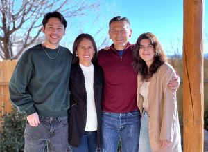 A mother and father with their two young adult children.