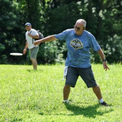 A disc golf player throws a disc during the National Senior Games.